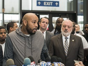 Leonard Gipson, one of 15 convicted men, talks to reporters after a judge in Chicago threw out the convictions of the men Thursday, Nov. 16, 2017.