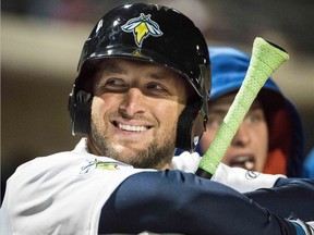 In April 6, 2017, file photo, Columbia Fireflies outfielder Tim Tebow smiles during a Class A minor league baseball game against the Augusta GreenJackets in Columbia, S.C.