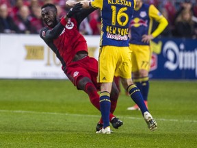 Toronto FC Jozy Altidore and New York Red Bulls’ Sacha Kljestan get into it at BMO Field on Sunday. Ernest Doroszuk/Toronto Sun/Postmedia Network