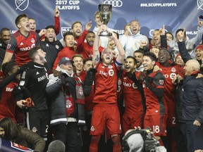 Toronto FC captain Michael Bradley hoists the Eastern Conference Cup after defeating the Columbus Crew 1-0 in Toronto, Ont. on Thursday November 30, 2017. Jack Boland/Toronto Sun/Postmedia Network