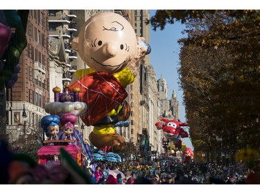 A Charlie Brown balloon moves along Central Park West during the Macy's Thanksgiving Day Parade in New York, Thursday, Nov. 23, 2017. (AP Photo/Craig Ruttle)