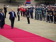 U.S. President Donald Trump, right on red carpet, walks with South Korea's President Moon Jae-in during a welcoming ceremony at the Presidential Blue House in Seoul Tuesday, Nov. 7, 2017. (Kim Hong-ji/Pool Photo via AP)