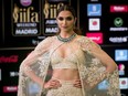 In this June 25, 2016 file photo, Bollywood actress Deepika Padukone poses for photographers at the International Indian Film Academy Rocks Green Carpet for the 17th Edition of IIFA Weekend & Awards in Madrid, Spain. (AP Photo/Samuel de Roman, File)