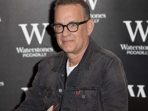 Tom Hanks signs copies of his short stories collection Uncommon Type in London, England, on Thursday, Nov. 2, 2017. (Phil Lewis/WENN.com)