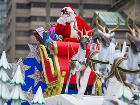 Santa Claus makes his way along the parade route during the Santa Claus parade in Toronto Nov. 20, 2016.