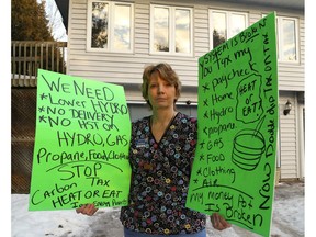 Single mom Kathy Katula, 54, from Buckhorn, Ont. with her placards at her home on Saturday January 14, 2017 near Peterborough, Ont.