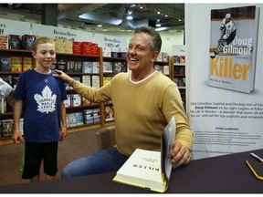 Canadian legend and Hockey Hall of Famer, Doug Gilmour shares a laugh with Colin Casey, 8,  as he signs copies of Killer: My Life In Hockey Ð a memoir that bares all about his on- and off-the-ice exploits and escapades on Thursday October 19, 2017 at Chapters Bookstore in Peterborough, Ont. 'No one ever expected the 134th overall draft pick to become a superstar, but thatÕs exactly what Doug Gilmour did,' states a press release from the publisher. 'During his early years in the NHL, he honed his killer instincts in the faceoff circle and in front of the net, developing the skills that would characterize his illustrious 20-year career.' The Kingston, Ontario native played for seven NHL teams and earned his place in the history books time and again.