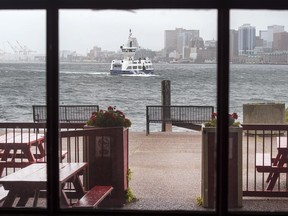 A cross-harbour ferry arrives in Dartmouth, N.S. on Monday, Nov. 6, 2017.Its nickname is the darkside, and for years it has stood in the shadows of Nova Scotia's capital. THE CANADIAN PRESS/Andrew Vaughan