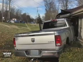 An 11-year-old girl allegedly drove a truck into a Louisville, Ky., home last Friday. She reportedly told cops she did it on purpose. (Screengrab/WDRB.com)