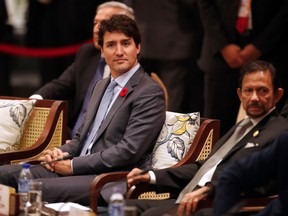 Prime Minister Justin Trudeau (C) and Brunei's Sultan Hassanal Bolkiah (R) attend the APEC-ASEAN dialogue on the sidelines of the Asia-Pacific Economic Cooperation (APEC) leaders' summit in the central Vietnamese city of Danang on November 10, 2017. (JORGE SILVA/AFP/Getty Images)