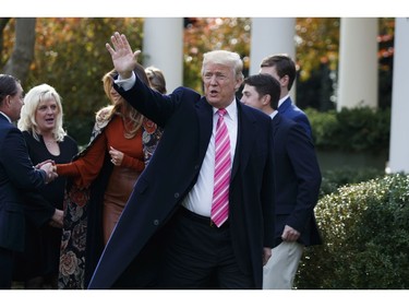 U.S. President Donald Trump waves as he leaves the National Thanksgiving Turkey Pardoning Ceremony in the Rose Garden of the White House, Tuesday, Nov. 21, 2017, in Washington. (AP Photo/Evan Vucci)