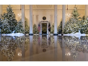 The Grand Foyer and Cross Hall are decorated with "The Nutcracker Suite" theme during a media preview of the 2017 holiday decorations at the White House in Washington, Monday, Nov. 27, 2017. (AP Photo/Carolyn Kaster)