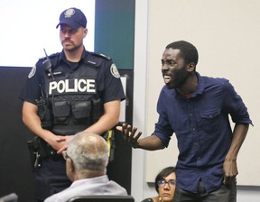 Desmond Cole interrupts the Toronto Police Services Board meeting along with members of Black Lives Matter at the on Thursday June 15, 2017.