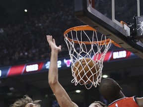 Toronto Raptors centre Jonas Valanciunas (17) with Chicago Bulls centre Robin Lopez (42) in Toronto. 
Veronica Henri/Toronto Sun/Postmedia Network