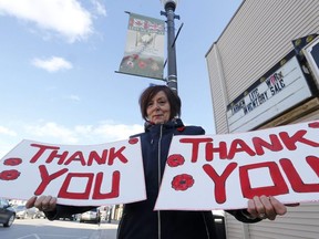 Francine Grenon made more than 100 cardboard signs thanking veterans that now line the stores along the main street of Bradford, Ont. Michael Peake/Toronto Sun
