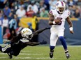 Buffalo Bills quarterback Tyrod Taylor breaks away from L.A. Chargers strong safety Jahleel Addae on Nov. 19, 2017