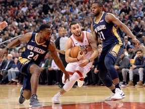 Toronto Raptors guard Fred VanVleet drives past New Orleans Pelicans forward Darius Miller on Nov. 9, 2017