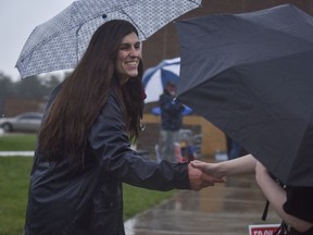 Danica Roem, who is running for house of delegates against GOP incumbent Robert Marshall, campaigns as voters take to the ballot boxes at Gainesville Middle School on Tuesday, Nov. 7, 2017, in Gainesville, Va.