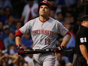 Cincinnati Reds' Joey Votto walks back to the dugout after being called out on strikes on Aug. 15, 2017