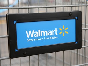 The Walmart logo is displayed on a shopping cart at a Walmart store on in Chicago on Aug. 15, 2013. (Scott Olson/Getty Images/Files)