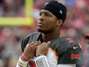 In this Oct. 15, 2017, file photo, Tampa Bay Buccaneers quarterback Jameis Winston stands on the sidelines