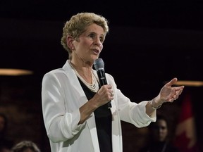 Ontario Premier Kathleen Wynne addresses questions from the public during a town hall meeting in Toronto on Monday, Nov. 20, 2017.  THE CANADIAN PRESS/Christopher Katsarov