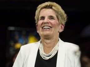 Premier Kathleen Wynne addresses questions from the public during a town hall meeting in Toronto on Monday, Nov. 20, 2017.