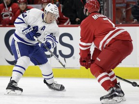 Toronto Maple Leafs' Morgan Rielly takes a quick shot on goal past Hurricanes' Ryan Murphy. Rielly takes fewer slap shots than any of the NHL's top offensive D-men. (AP Photo/Gerry Broome)