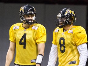 If the Hamilton Tiger Cats re-sign free-agent quarterback Jeremiah Masoli (right), they will likely have to cut big-money QB  Zach Collaros before a Feb. 1 roster bonus kicks in. (POSTMEDIA NETWORK)