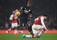 Manchester United midfielder Paul Pogba stamps on Arsenal's Hector Bellerin during their game on Saturday. 
 (GETTY IMAGES)