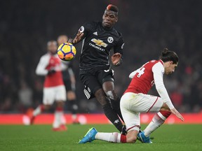 Manchester United midfielder Paul Pogba stamps on Arsenal's Hector Bellerin during their game on Saturday. 
 (GETTY IMAGES)
