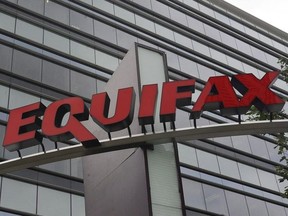 Signage at the corporate headquarters of Equifax Inc. in Atlanta on July 21, 2012. Equifax Canada has revised the number of Canadians caught up in a massive data breach earlier this year, saying an investigation has found that more than 19,000 were affected.