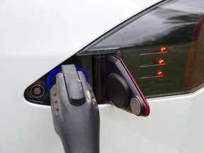Charging a Tesla electric vehicle. (Wayne Cuddington/Postmedia Network)