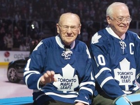 Former Maple Leafs goalie Johnny Bower, left, and George Armstrong are paraded around the ice at the 50th anniversary of the team's 1963 Stanley Cup victory ahead of the Toronto Maple Leafs game against the Ottawa Senators in Toronto on Feb. 16, 2013.