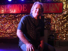 Horseshoe Tavern co-owner Jeff Cohen is pictured on the stage inside the bar.