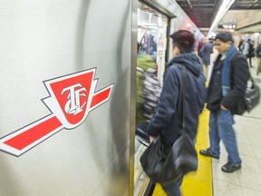 Passengers board a TTC subway.