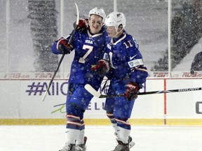 Team USA's Brady Tkachuk celebrates his goal against Canada with Casey Mittelstadt, right, on Dec. 29, 2017