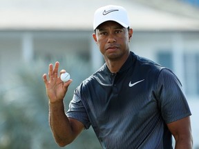 Tiger Woods of the United States reacts to his par on the fifth green during the third round of the Hero World Challenge at Albany, Bahamas on December 2, 2017 in Nassau, Bahamas.  (Photo by Mike Ehrmann/Getty Images)