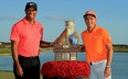 Rickie Fowler of the United States poses with tournament host Tiger Woods after winning the Hero World Challenge at Albany, Bahamas on December 3, 2017 in Nassau, Bahamas.  (Photo by Mike Ehrmann/Getty Images)