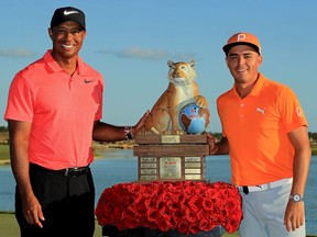 Rickie Fowler of the United States poses with tournament host Tiger Woods after winning the Hero World Challenge at Albany, Bahamas on December 3, 2017 in Nassau, Bahamas.  (Photo by Mike Ehrmann/Getty Images)