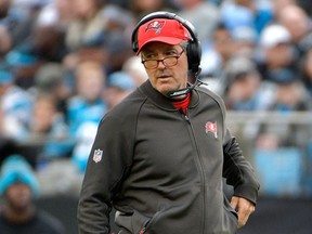 Head coach Dirk Koetter of the Tampa Bay Buccaneers reacts between plays against the Carolina Panthers during their game at Bank of America Stadium on December 24, 2017 in Charlotte, North Carolina.