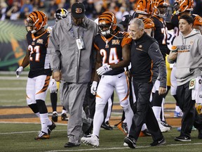 Cincinnati Bengals cornerback Adam Jones (24) is helped off the field after an apparent injury in the first half of an NFL football game against the Pittsburgh Steelers, Monday, Dec. 4, 2017, in Cincinnati. (AP Photo/Frank Victores)