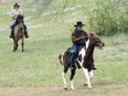 Republican senate nominee Roy Moore rides a horse to a polling station to cast his ballot in Alabama's special Senate election, Tuesday, Dec. 12, 2017, in Gallant, Ala.