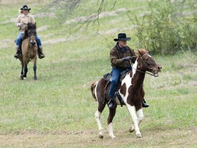 Republican senate nominee Roy Moore rides a horse to a polling station to cast his ballot in Alabama's special Senate election, Tuesday, Dec. 12, 2017, in Gallant, Ala.