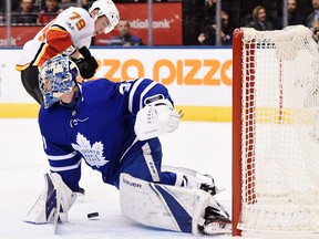 Toronto Maple Leafs goalie Frederik Andersen makes a save on Calgary Flames left winger Micheal Ferland on Dec. 6, 2017