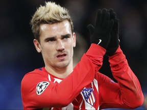 Atletico's Antoine Griezmann applauds fans after the 1-1 draw in the Champions League Group C match between Chelsea and Atletico Madrid at Stamford Bridge stadium in London on Tuesday, Dec. 5, 2017.