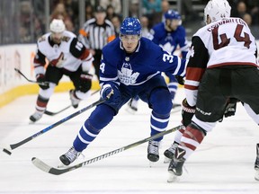 Toronto Maple Leafs centre Auston Matthews skates the puck up ice as Arizona Coyotes defenceman Kevin Connauton defends on Nov. 20, 2017