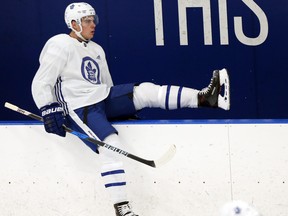 Auston Matthews hops the boards during Maple Leafs practice at the Mastercard Centre in Toronto on Dec. 8, 2017.