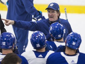 Toronto Maple Leafs head coach Mike Babcock talks with his team at practice on Dec. 5, 2017