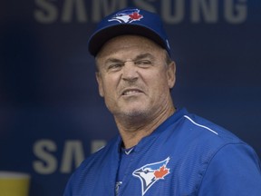 Toronto Blue Jays Manager John Gibbons stands in the dugout before Major League baseball action against the Boston Red Sox, in Toronto on Monday, August 28, 2017. THE CANADIAN PRESS/Chris Young